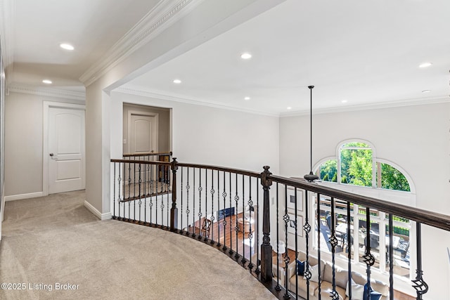 hallway with carpet floors, recessed lighting, baseboards, and crown molding