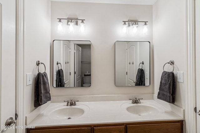 bathroom featuring double vanity