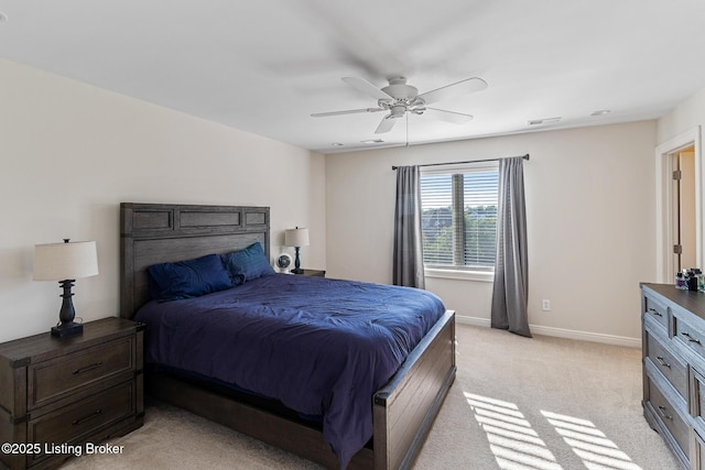 bedroom featuring light carpet, baseboards, and ceiling fan