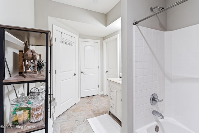 bathroom featuring shower / washtub combination and vanity