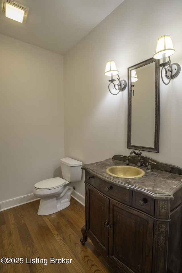 895 Woodlawn Rd Unit 2, Bardstown, KY 40004 - bathroom with toilet, wood finished floors, baseboards, and vanity