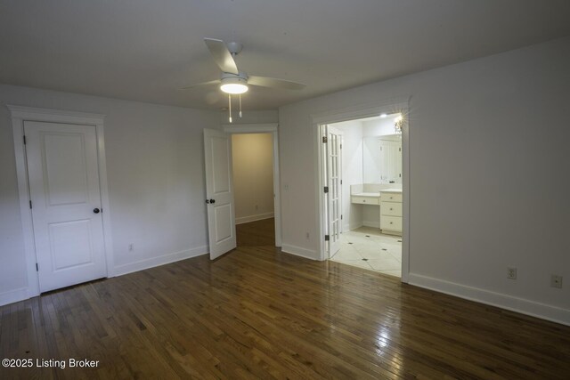 895 Woodlawn Rd Unit 2, Bardstown, KY 40004 - unfurnished bedroom featuring hardwood / wood-style flooring, baseboards, and connected bathroom