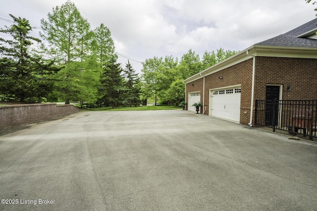 895 Woodlawn Rd Unit 2, Bardstown, KY 40004 - view of side of home with asphalt driveway and brick siding