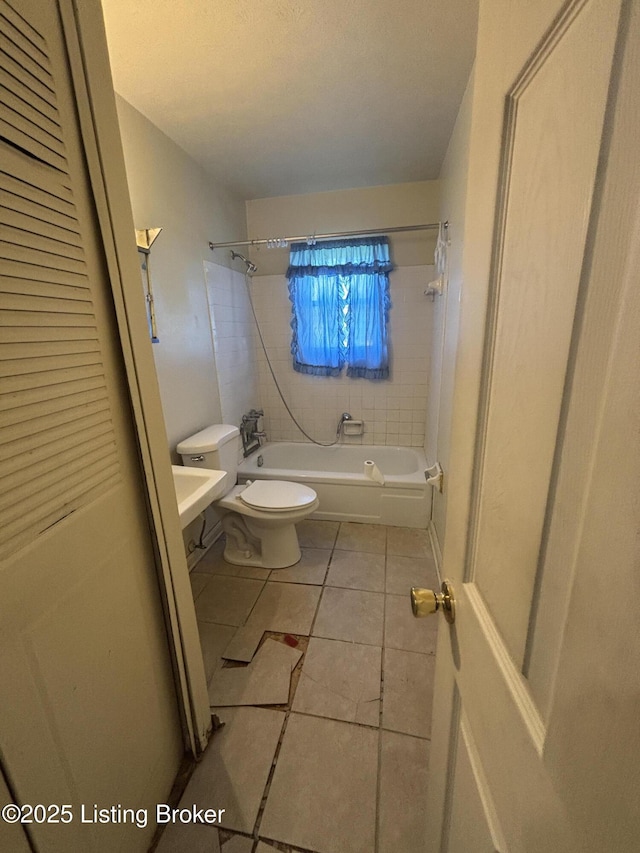 1314 S 36th St, Louisville, KY 40211 - bathroom featuring  shower combination, toilet, and tile patterned flooring