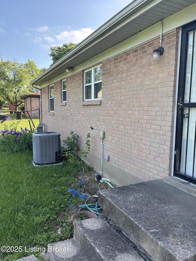 1314 S 36th St, Louisville, KY 40211 - view of side of property featuring central AC unit and brick siding
