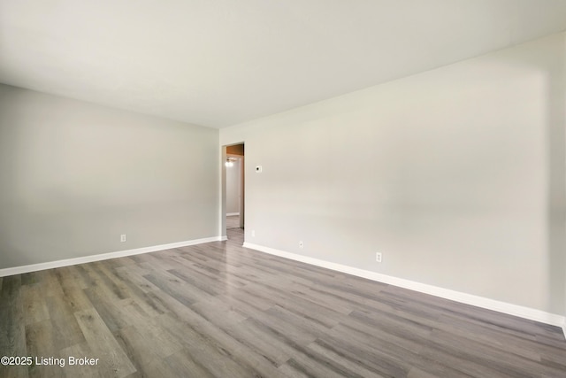 2410 Waco Ct, Louisville, KY 40216 - unfurnished room featuring wood finished floors and baseboards