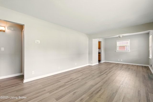 2410 Waco Ct, Louisville, KY 40216 - unfurnished room featuring wood finished floors and baseboards