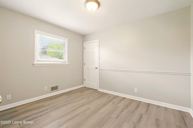 2410 Waco Ct, Louisville, KY 40216 - empty room with light wood-type flooring and baseboards