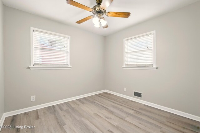 2410 Waco Ct, Louisville, KY 40216 - spare room featuring wood finished floors, baseboards, and ceiling fan