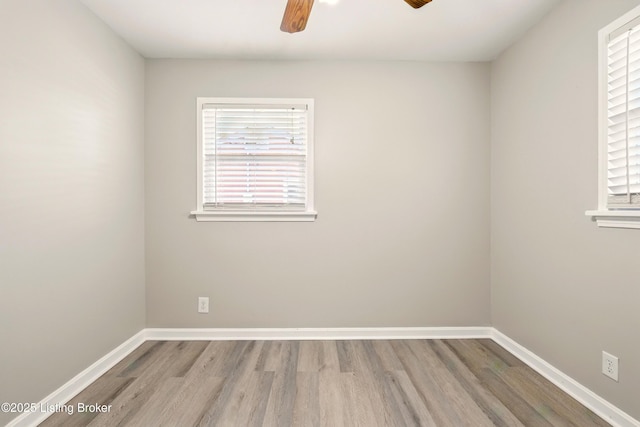 2410 Waco Ct, Louisville, KY 40216 - empty room featuring a ceiling fan, wood finished floors, and baseboards
