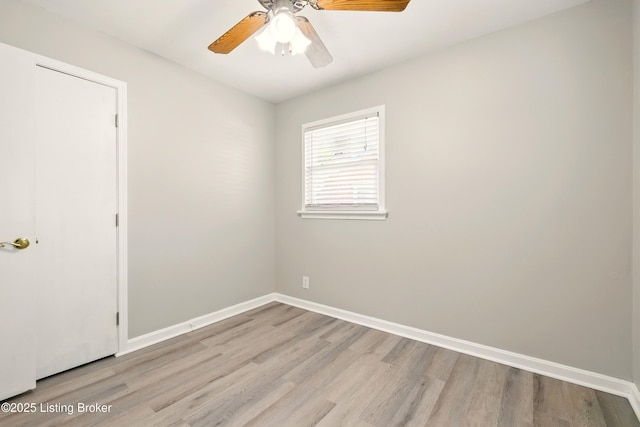 2410 Waco Ct, Louisville, KY 40216 - spare room with light wood finished floors, ceiling fan, and baseboards