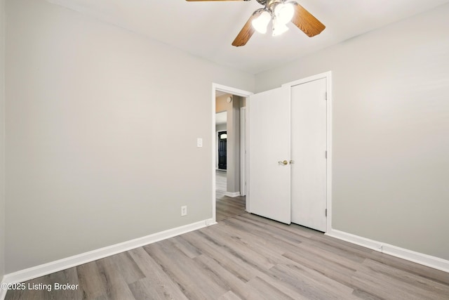 2410 Waco Ct, Louisville, KY 40216 - unfurnished bedroom featuring light wood-style flooring, baseboards, and a ceiling fan