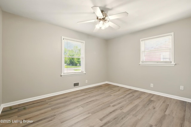 2410 Waco Ct, Louisville, KY 40216 - unfurnished room with light wood-style flooring, baseboards, and ceiling fan