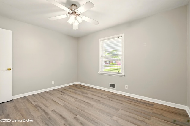 2410 Waco Ct, Louisville, KY 40216 - unfurnished room featuring wood finished floors, baseboards, and a ceiling fan