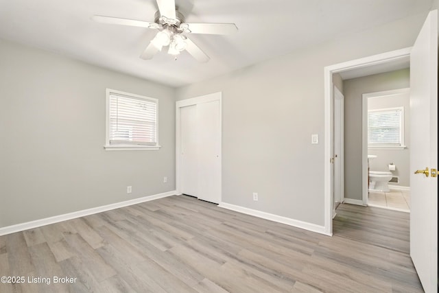 2410 Waco Ct, Louisville, KY 40216 - unfurnished bedroom with light wood-type flooring, a closet, baseboards, and a ceiling fan