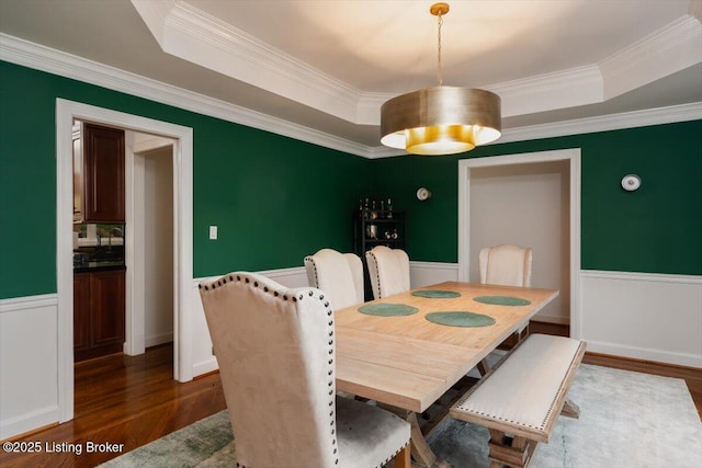 11308 Bodley Dr, Louisville, KY 40223 - dining space with a raised ceiling, dark wood finished floors, wainscoting, and crown molding