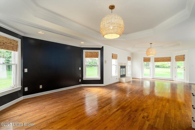 11308 Bodley Dr, Louisville, KY 40223 - unfurnished living room featuring wood finished floors, crown molding, a chandelier, a raised ceiling, and baseboards
