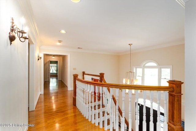 11308 Bodley Dr, Louisville, KY 40223 - hall with an upstairs landing, healthy amount of natural light, light wood-type flooring, ornamental molding, and a chandelier