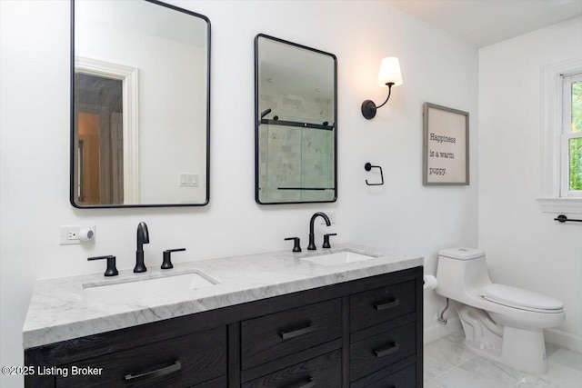 11308 Bodley Dr, Louisville, KY 40223 - bathroom featuring toilet, double vanity, baseboards, and marble finish flooring