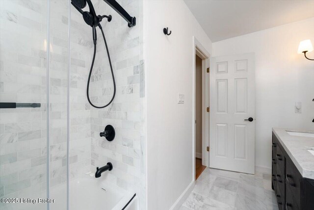 11308 Bodley Dr, Louisville, KY 40223 - bathroom featuring tiled shower, baseboards, vanity, and marble look tile flooring