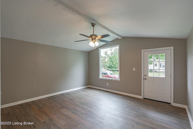 unfurnished room featuring dark wood finished floors, a ceiling fan, and baseboards
