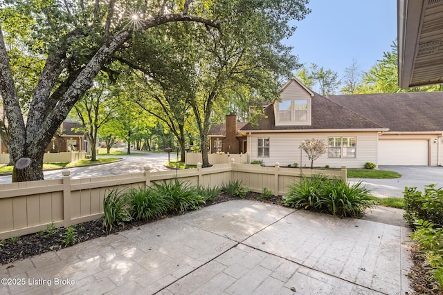 3010 Graystone Manor Pkwy, Louisville, KY 40241 - view of patio / terrace featuring an attached garage and driveway