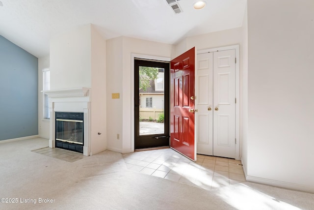 3010 Graystone Manor Pkwy, Louisville, KY 40241 - carpeted foyer with a fireplace with flush hearth, baseboards, and tile patterned flooring