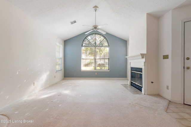 3010 Graystone Manor Pkwy, Louisville, KY 40241 - unfurnished living room featuring ceiling fan, a fireplace with flush hearth, carpet, vaulted ceiling, and a textured ceiling