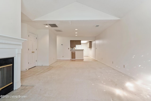 3010 Graystone Manor Pkwy, Louisville, KY 40241 - unfurnished living room with a fireplace with flush hearth, light colored carpet, recessed lighting, and baseboards