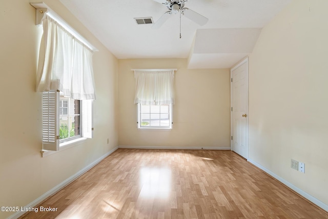 3010 Graystone Manor Pkwy, Louisville, KY 40241 - unfurnished room featuring plenty of natural light, light wood-type flooring, ceiling fan, and baseboards