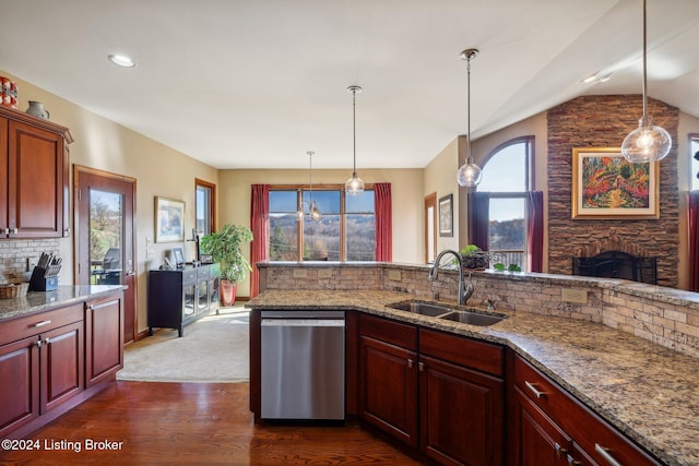 kitchen featuring stainless steel dishwasher, a sink, dark wood-style floors, tasteful backsplash, and pendant lighting