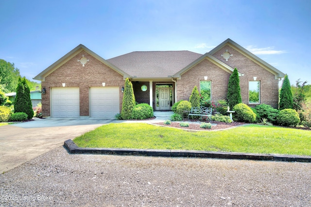 traditional home featuring concrete driveway, an attached garage, brick siding, and a front yard