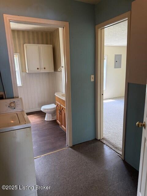 229 Beech Grove Rd, Shepherdsville, KY 40165 - bathroom featuring washer / clothes dryer, toilet, electric panel, vanity, and wood finished floors