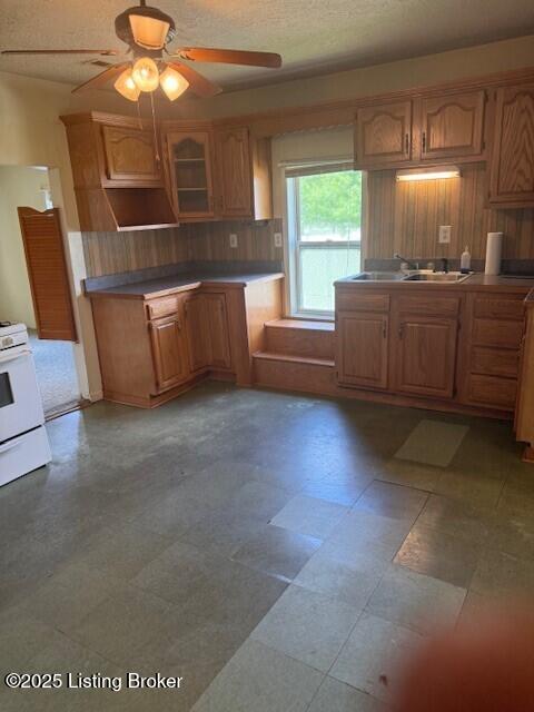 229 Beech Grove Rd, Shepherdsville, KY 40165 - kitchen featuring a sink, a ceiling fan, white gas range, tasteful backsplash, and tile patterned floors