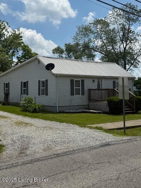 229 Beech Grove Rd, Shepherdsville, KY 40165 - ranch-style house with metal roof, a front yard, and gravel driveway