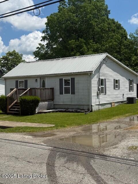 229 Beech Grove Rd, Shepherdsville, KY 40165 - view of front of home featuring metal roof, central AC unit, and a front lawn
