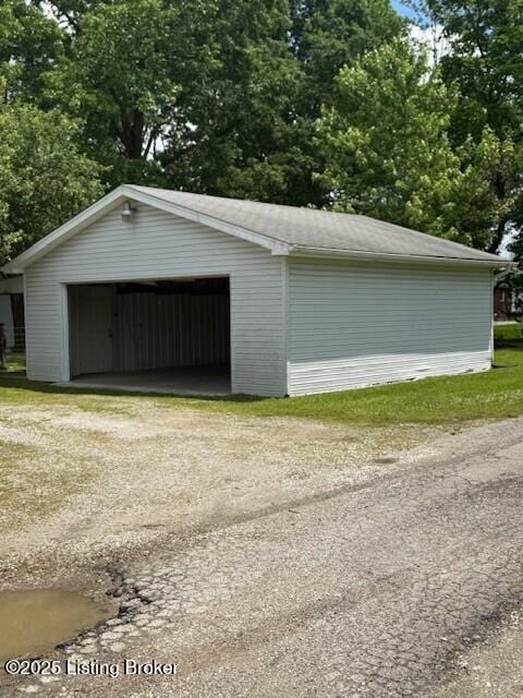 229 Beech Grove Rd, Shepherdsville, KY 40165 - detached garage featuring view of wooded area