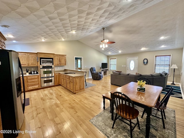 744 Bear Creek Rd, Leitchfield, KY 42754 - dining space with a ceiling fan, light wood-type flooring, and lofted ceiling