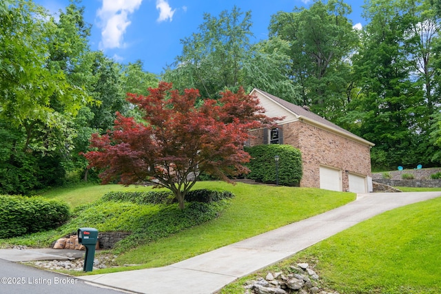 view of home's exterior with a lawn, brick siding, a garage, and driveway