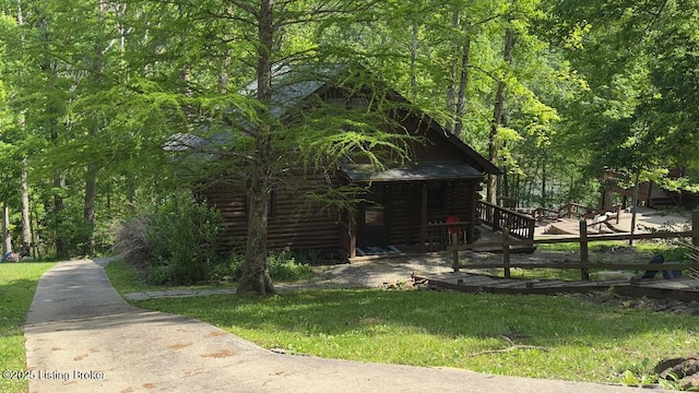 403 Timberlake Ln, Mcdaniels, KY 40152 - view of side of property featuring log exterior and a forest view