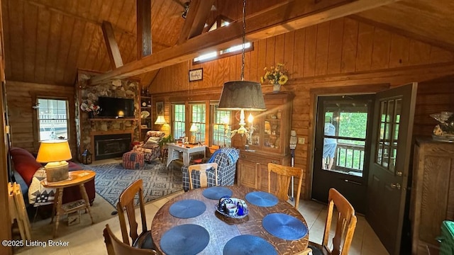 403 Timberlake Ln, Mcdaniels, KY 40152 - dining room featuring wooden walls, beamed ceiling, high vaulted ceiling, a fireplace, and tile patterned floors