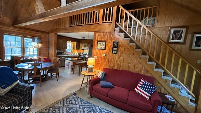 403 Timberlake Ln, Mcdaniels, KY 40152 - living area featuring wood walls, stairs, and high vaulted ceiling
