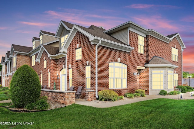 10201 Lark Meadow Dr, Louisville, KY 40291 - view of front facade with a yard, brick siding, and roof with shingles