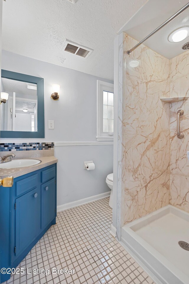 263 Hampton Rd, Brandenburg, KY 40108 - bathroom with a shower stall, toilet, vanity, decorative backsplash, and a textured ceiling