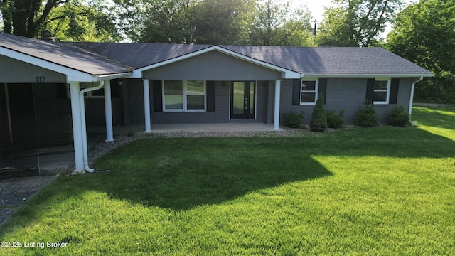 117 Northridge Dr, Bedford, KY 40006 - view of front of property with a front yard, brick siding, and roof with shingles