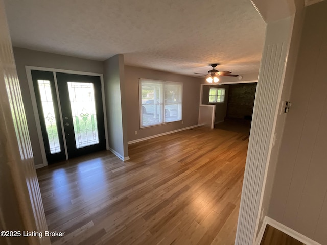 117 Northridge Dr, Bedford, KY 40006 - entryway featuring a textured ceiling, a ceiling fan, wood finished floors, and baseboards