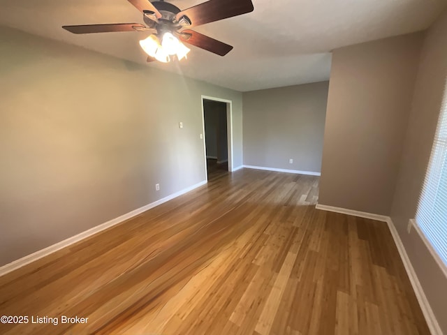 117 Northridge Dr, Bedford, KY 40006 - unfurnished room with wood finished floors, baseboards, and a ceiling fan