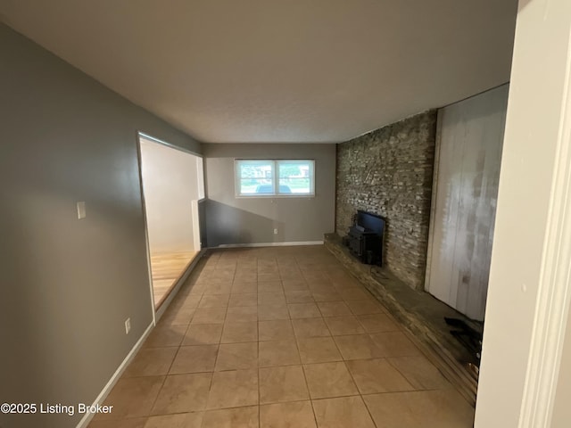 117 Northridge Dr, Bedford, KY 40006 - unfurnished living room featuring light tile patterned floors and baseboards