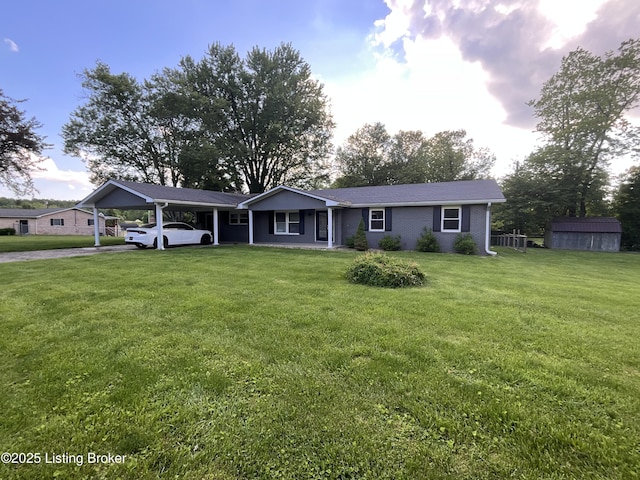 117 Northridge Dr, Bedford, KY 40006 - single story home featuring a shed, an outdoor structure, a carport, and a front lawn