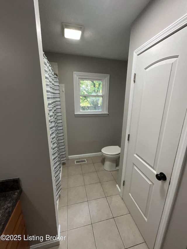 117 Northridge Dr, Bedford, KY 40006 - bathroom featuring toilet, vanity, tile patterned flooring, baseboards, and a shower with curtain